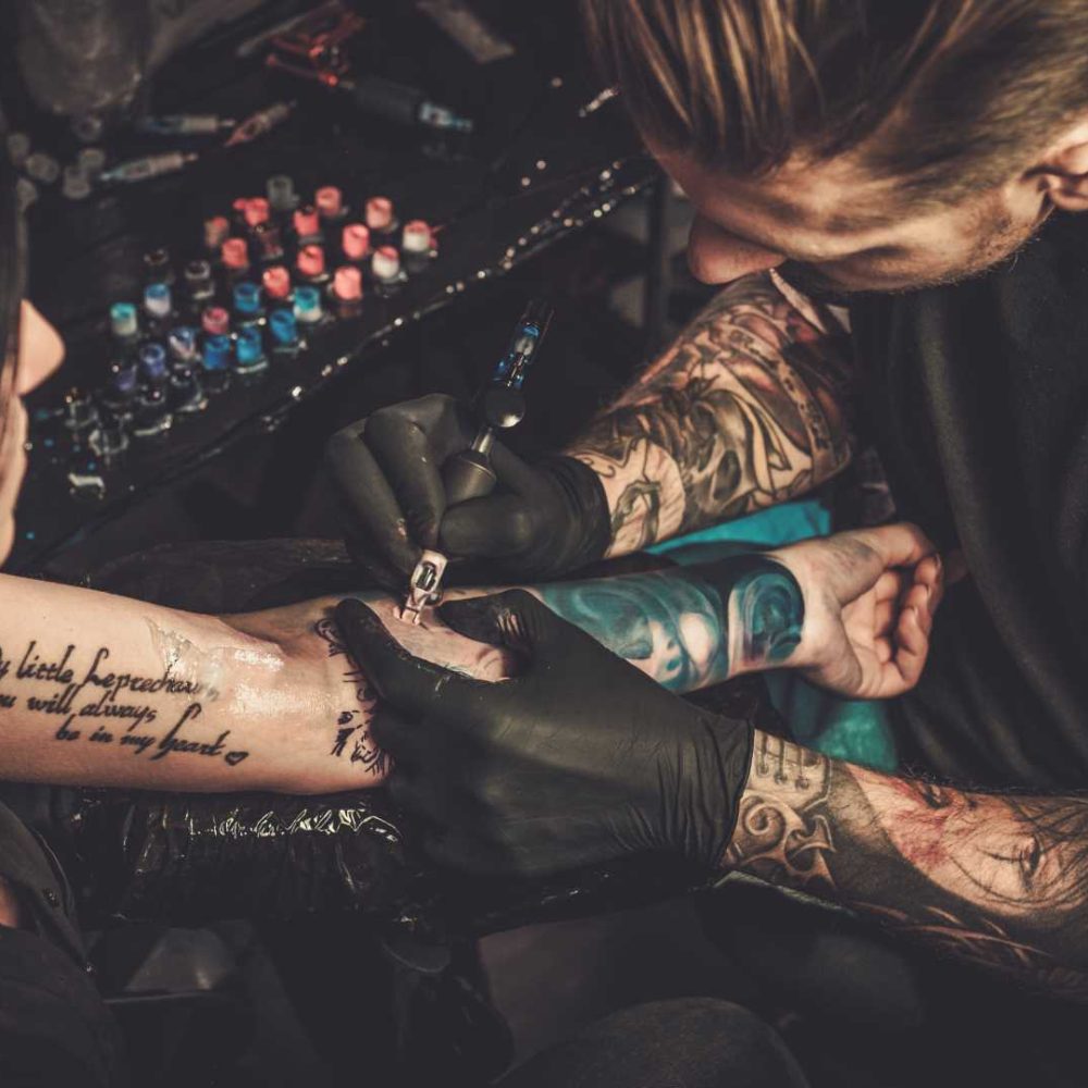 professional-tattoo-artist-makes-a-tattoo-on-a-you-2021-08-26-16-21-12-utc
